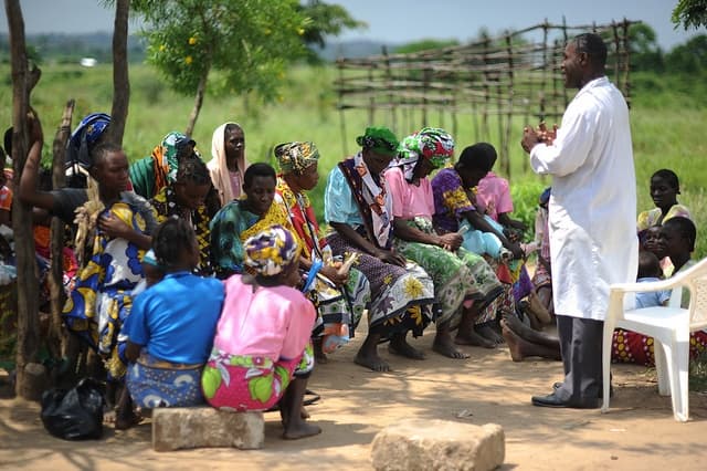 OUNUU team members working with community